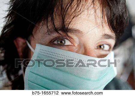 Woman wearing mask View Large Photo Image Stock Image - Woman wearing mask. Fotosearch