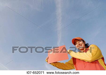 Woman wearing the Chinese Olympic Uniform colors - holding the Chinese Flag View Large Photo Image Stock Image - Woman wearing the Chinese Olympic Uniform colors - holding the Chinese Flag. Fotosearch