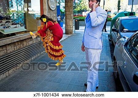Woman wearing traditional gypsy dress in Asunci? n street during the April Fair Feria de Abril Seville, Andalusia, Spain View Large Photo Image Picture - Woman wearing traditional gypsy dress in Asunci? n street during the April Fair Feria de Abril Seville, Andalusia, Spain. Fotosearch