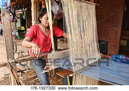 woman weaving in Vang Vieng, Laos View Large Photo Image Stock Image - woman weaving in Vang Vieng, Laos. Fotosearch