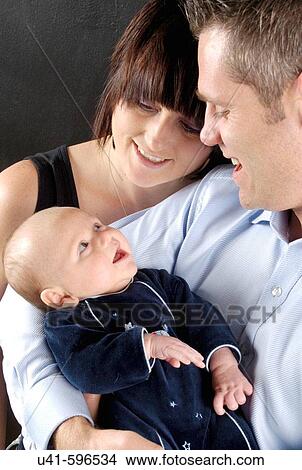 Woman with 2 week baby and husband. View Large Photo Image Picture - Woman with 2 week baby and husband.. Fotosearch