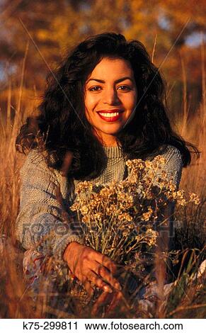 woman with a bouquet of fall flowers View Large Photo Image Stock Image - woman with a bouquet of fall flowers. Fotosearch