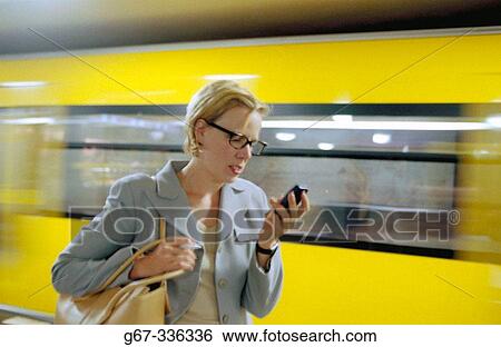 Woman with a cellphone. Berlin. Germany. View Large Photo Image Stock Photograph - Woman with a cellphone. Berlin. Germany.. Fotosearch