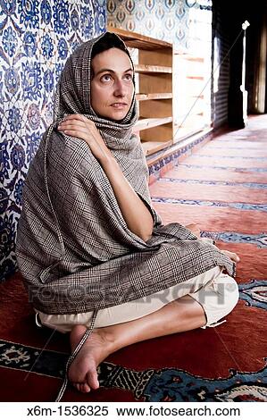 Stock Photography - Woman with a chador. Rustem Pasha mosque. Istanbul, Turkey. Fotosearch