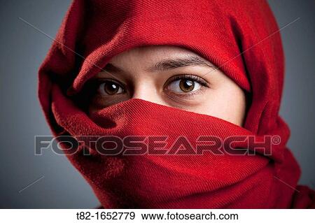 Woman with a red veil View Large Photo Image Stock Photo - Woman with a red veil. Fotosearch