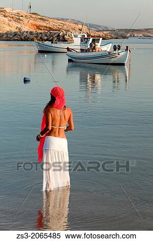 Woman with a scarf in the sea, Koufonissi, Cyclades Islands, Greek Islands, Greece, Europe. View Large Photo Image Stock Photography - Woman with a scarf in the sea, Koufonissi, Cyclades Islands, Greek Islands, Greece, Europe.. Fotosearch