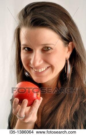 Woman with apple View Large Photo Image Picture - Woman with apple. Fotosearch