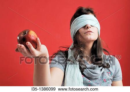 Stock Photo - Woman with apple. Fotosearch