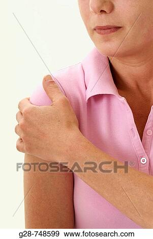 Stock Photo - Woman with arm pain. Fotosearch