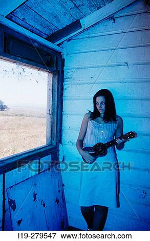 Stock Photo - woman with banjo. Fotosearch