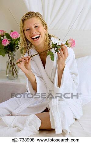 Woman with bathrobe at home View Large Photo Image Stock Photo - Woman with bathrobe at home. Fotosearch