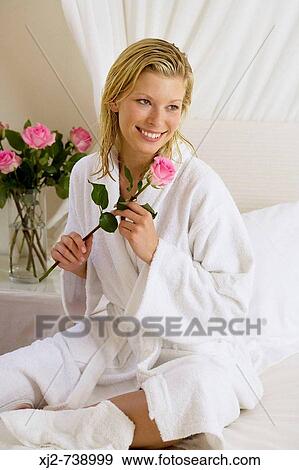 Stock Photo - Woman with bathrobe at home. Fotosearch