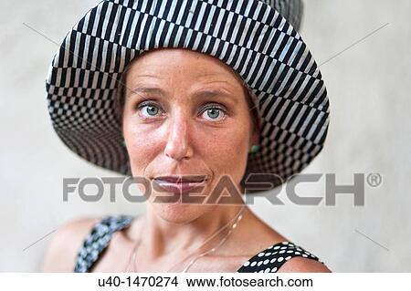Woman with big hat View Large Photo Image Picture - Woman with big hat. Fotosearch