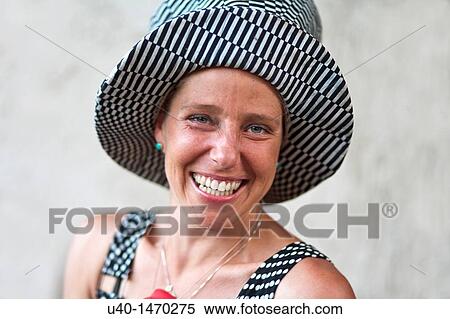 Woman with big hat View Large Photo Image Stock Photography - Woman with big hat. Fotosearch