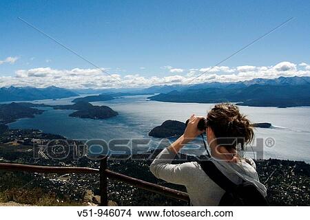 Woman with binoculars in Bariloche, Argentina View Large Photo Image Picture - Woman with binoculars in Bariloche, Argentina. Fotosearch