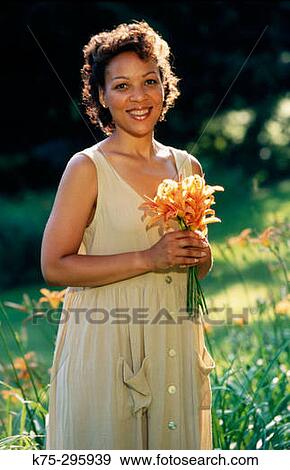 woman with bouquet of lilies outdoors View Large Photo Image Stock Photo - woman with bouquet of lilies outdoors. Fotosearch