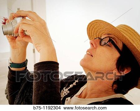 Woman with camera View Large Photo Image Picture - Woman with camera. Fotosearch