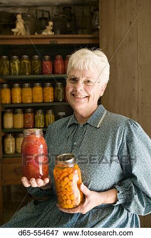 Woman with Canned Vegetables. Living History Farm at the LBJ Ranch. Johnson City. Hill Country. Texas, USA. View Large Photo Image Stock Photo - Woman with Canned Vegetables. Living History Farm at the LBJ Ranch. Johnson City. Hill Country. Texas, USA.. Fotosearch
