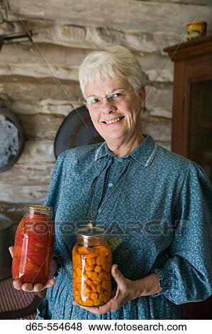 Stock Photo - Woman with Canned Vegetables. Living History Farm at the LBJ Ranch. Johnson City. Hill Country. Texas, USA.. Fotosearch
