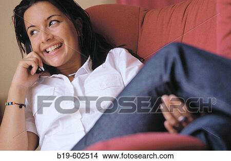 Picture - Woman with cell phone. Fotosearch