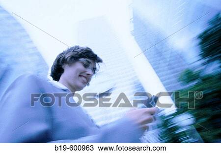 Stock Image - Woman with cell phone. Fotosearch