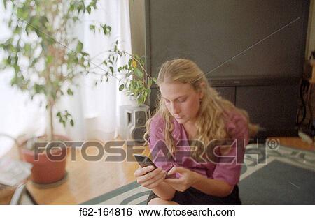 Woman with cell phone View Large Photo Image Stock Photograph - Woman with cell phone. Fotosearch