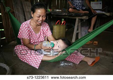 Woman with child in My Duc, Vietnam View Large Photo Image Stock Image - Woman with child in My Duc, Vietnam. Fotosearch