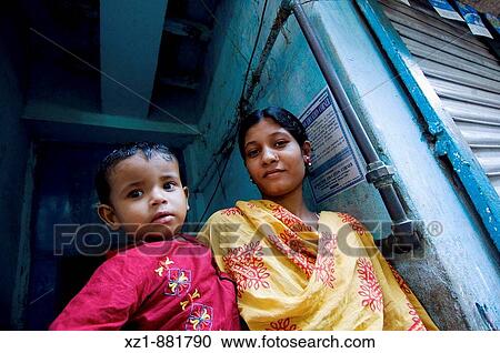 Woman with child in the old city area, Dhaka, Bangladesh View Large Photo Image Stock Image - Woman with child in the old city area, Dhaka, Bangladesh. Fotosearch