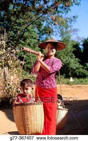 Woman with children. Inden village. Inle Lake. Shan State. Myanmar. View Large Photo Image Stock Photo - Woman with children. Inden village. Inle Lake. Shan State. Myanmar.. Fotosearch