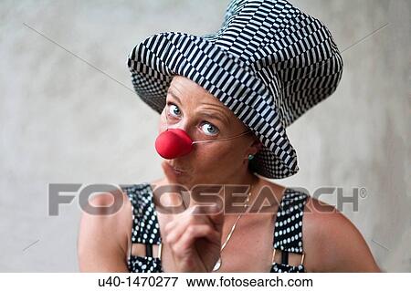 Stock Photo - Woman with clown nose making faces. Fotosearch