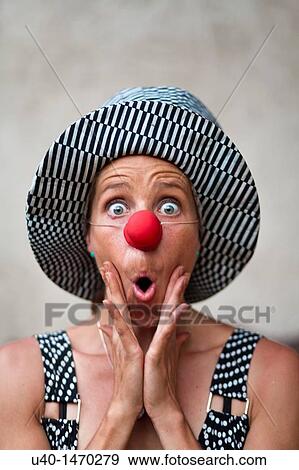 Stock Photo - Woman with clown nose making faces. Fotosearch