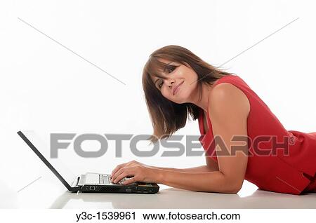 Woman with computer on the floor View Large Photo Image Stock Image - Woman with computer on the floor. Fotosearch