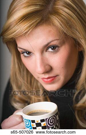 Woman with cup of coffee View Large Photo Image Stock Photograph - Woman with cup of coffee. Fotosearch