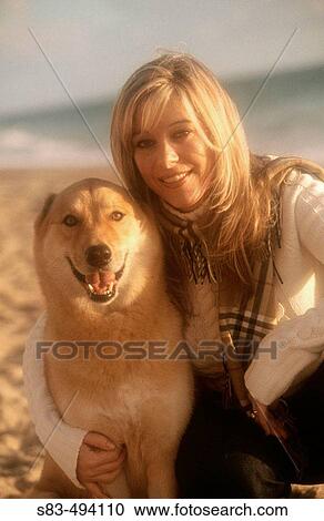 Woman with dog at beach View Large Photo Image Stock Image - Woman with dog at beach. Fotosearch