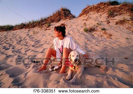 Woman with dog on Philbin Beach, Gay Head, Martha's Vineyard. Massachusetts, USA View Large Photo Image Stock Image - Woman with dog on Philbin Beach, Gay Head, Martha's Vineyard. Massachusetts, USA. Fotosearch