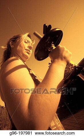 Woman with dumbbell View Large Photo Image Stock Image - Woman with dumbbell. Fotosearch