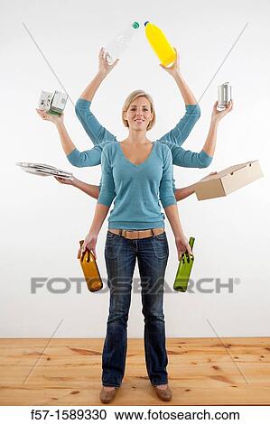 Woman with eight arms holding recyclable materials View Large Photo Image Stock Image - Woman with eight arms holding recyclable materials. Fotosearch