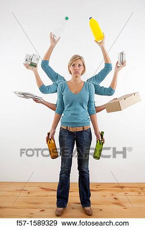 Woman with eight arms holding recyclable materials View Large Photo Image Stock Photo - Woman with eight arms holding recyclable materials. Fotosearch