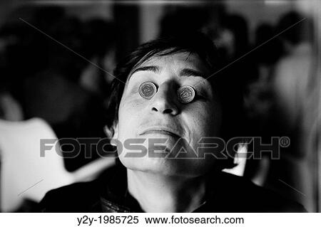 Stock Photography - Woman with euros in eyes. Fotosearch