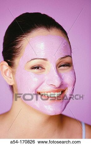 Stock Photograph - Woman with facial mask. Fotosearch