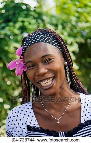 Woman with flower in hair, Sosua, Dominican Republic View Large Photo Image Picture - Woman with flower in hair, Sosua, Dominican Republic. Fotosearch