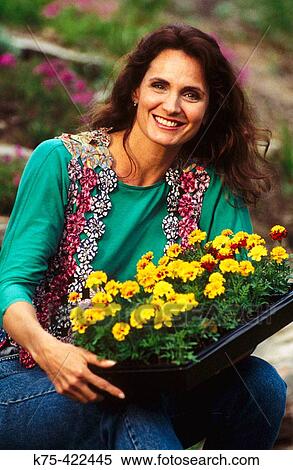 Stock Photography - woman with flowers. Fotosearch