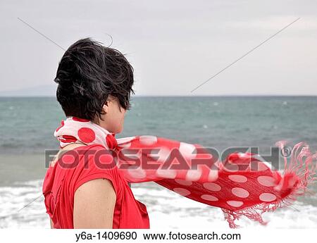 Woman with flowing red scarf View Large Photo Image Stock Image - Woman with flowing red scarf. Fotosearch