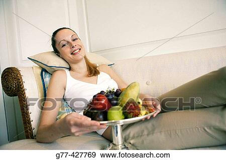 Stock Photo - Woman with fruits.. Fotosearch
