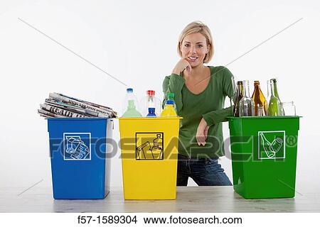 Woman with full recyling bins View Large Photo Image Picture - Woman with full recyling bins. Fotosearch