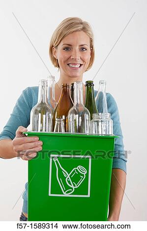 Woman with full recyling bins View Large Photo Image Picture - Woman with full recyling bins. Fotosearch