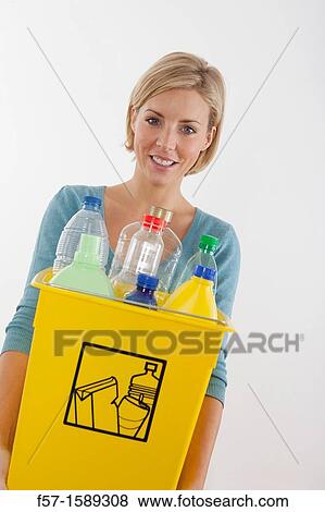 Woman with full recyling bins View Large Photo Image Stock Photo - Woman with full recyling bins. Fotosearch