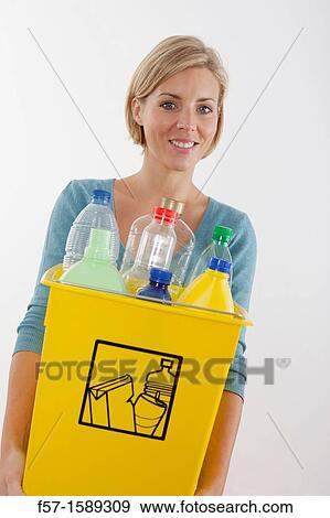 Woman with full recyling bins View Large Photo Image Stock Photo - Woman with full recyling bins. Fotosearch
