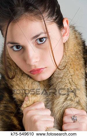 Stock Image - woman with fur around her neck. Fotosearch