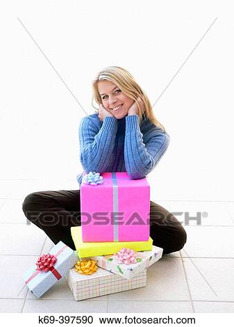 Stock Image - Woman with gift boxes. Fotosearch